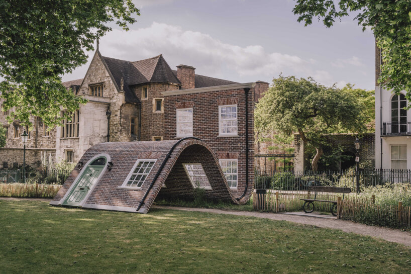 alex chinneck monumental brick facade sculpture
