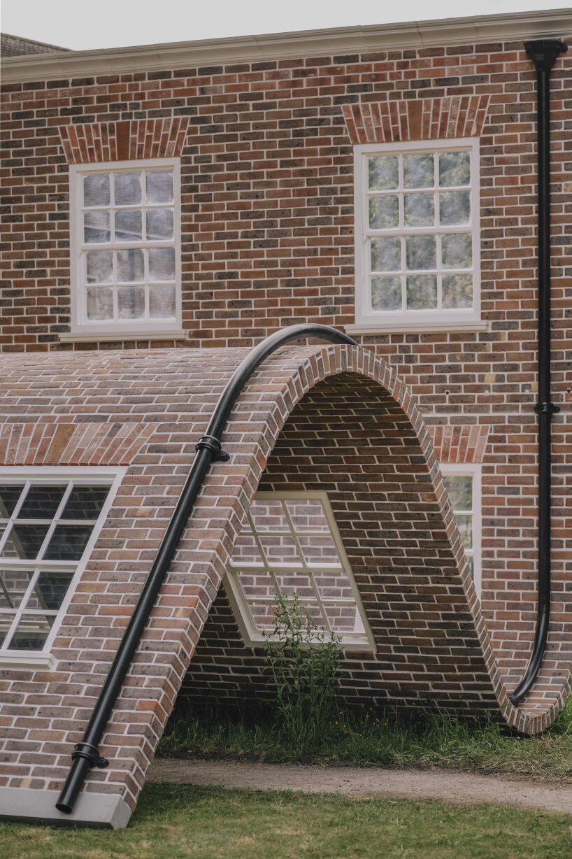 alex chinneck monumental brick facade sculpture