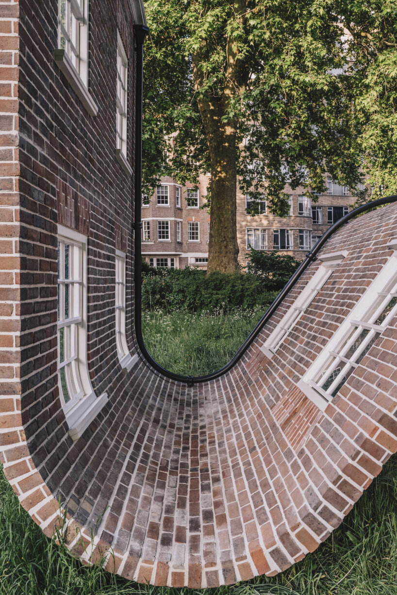 alex chinneck monumental brick facade sculpture