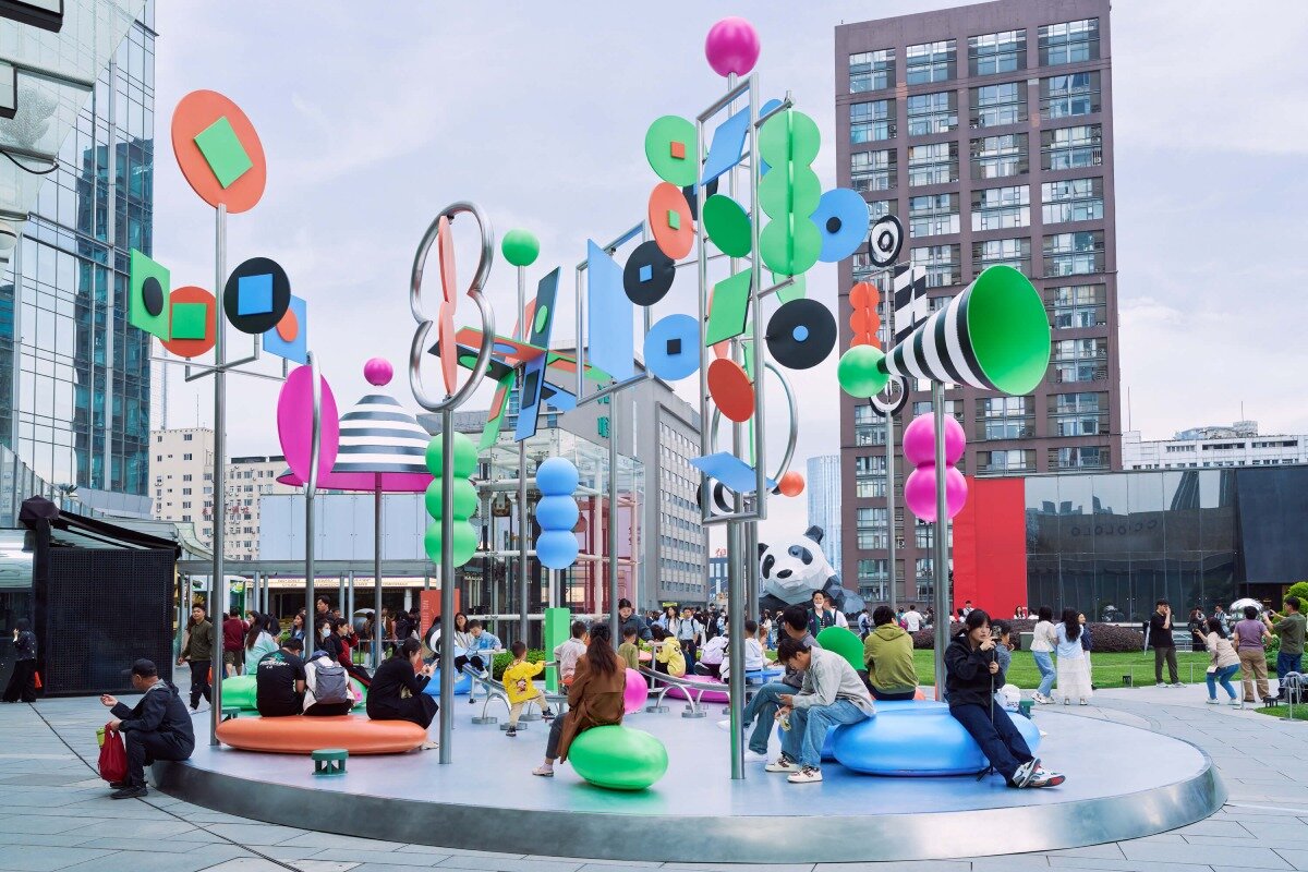 wade and leta's colorful constellation of shapes and patterns spin on urban rooftop in china