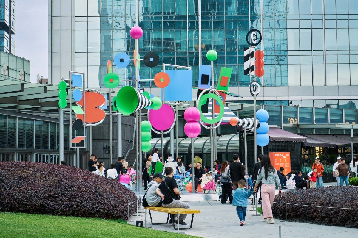 wade and leta's colorful constellation of shapes and patterns spin on urban rooftop in china