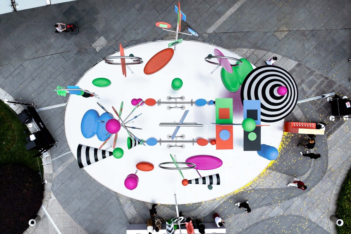 wade and leta's colorful constellation of shapes and patterns spin on urban rooftop in china