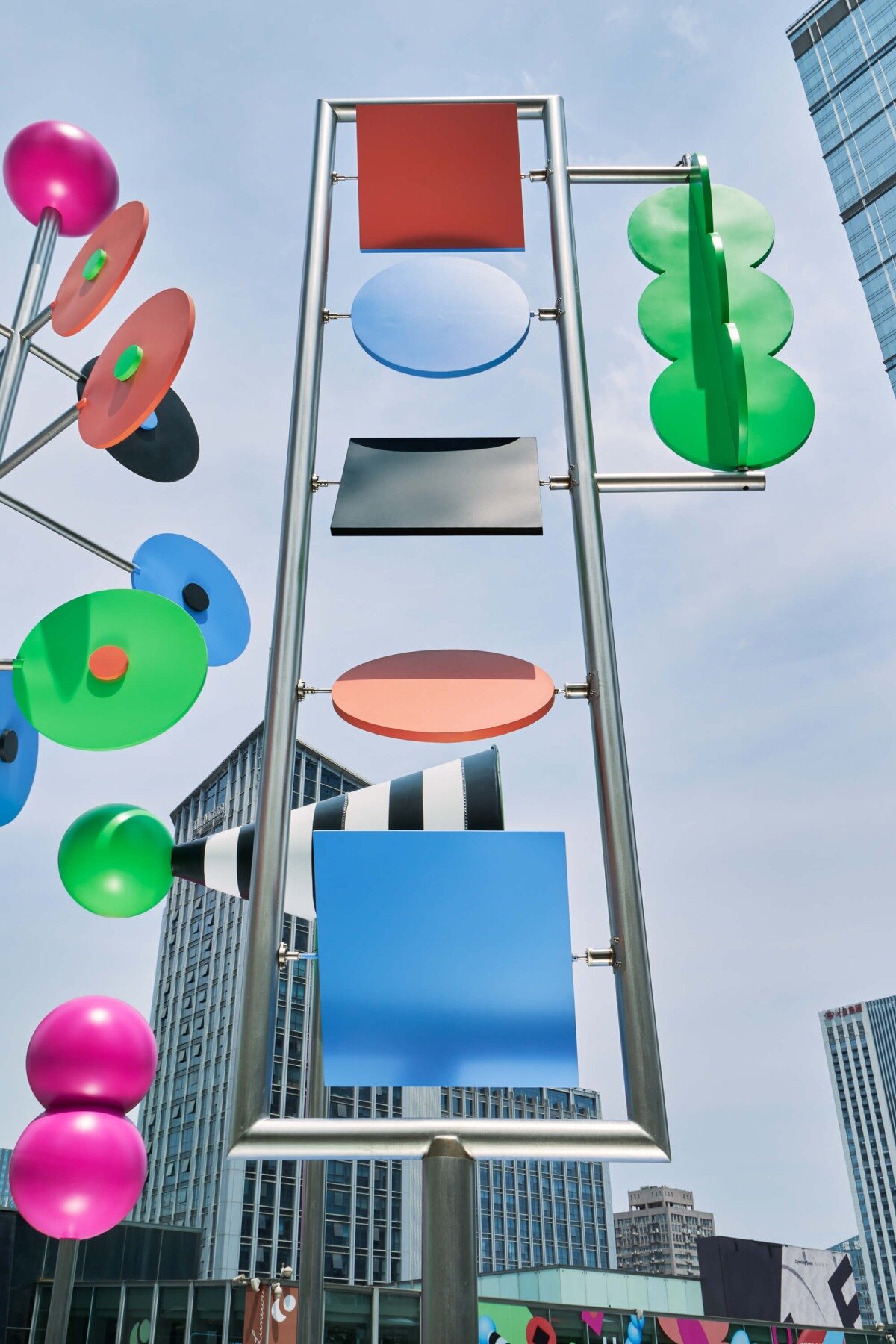wade and leta's colorful constellation of shapes and patterns spin on urban rooftop in china